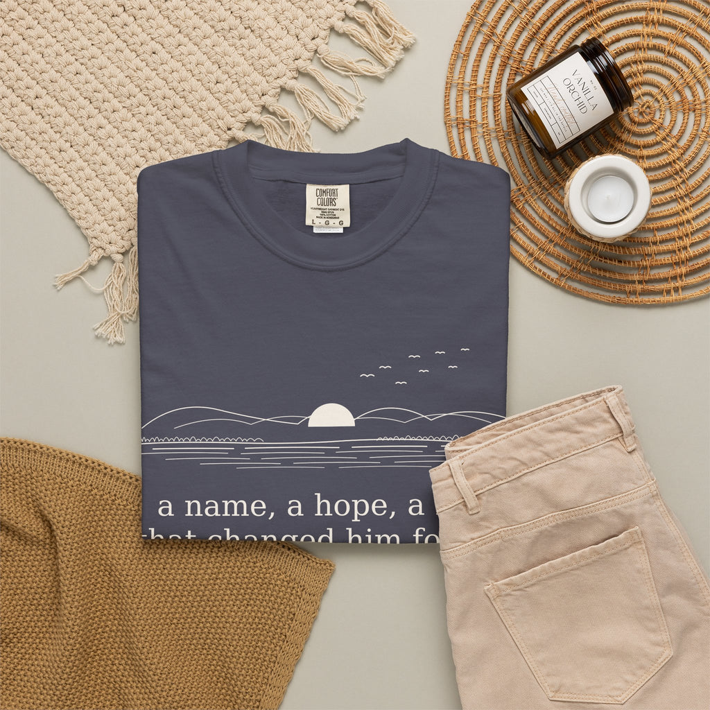 Literary Quote Sunset T-Shirt — "a name, a hope, a Love that changed him forever."